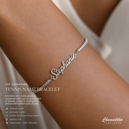 Silver cursive name bracelet on a wrist reading 'Stephanie' with a bejeweled band, jewelry advertisement.